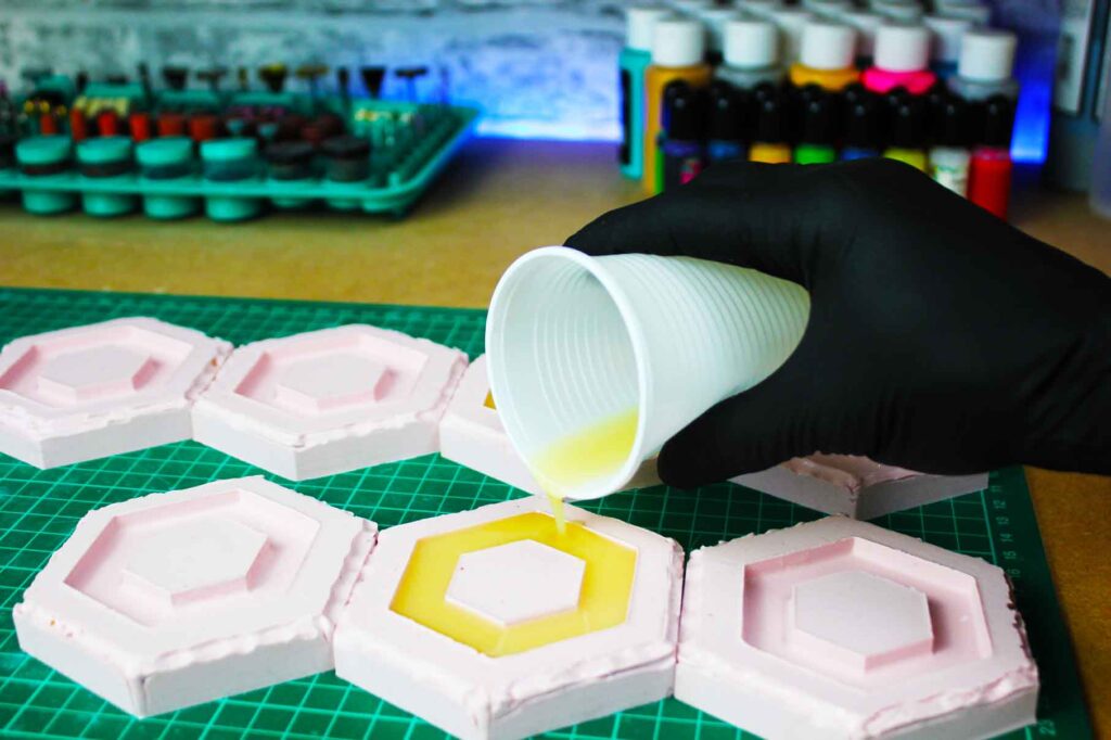 elliot-from-microworkshops-poring-silicone-molds-of-hex-shaped-bracelets
